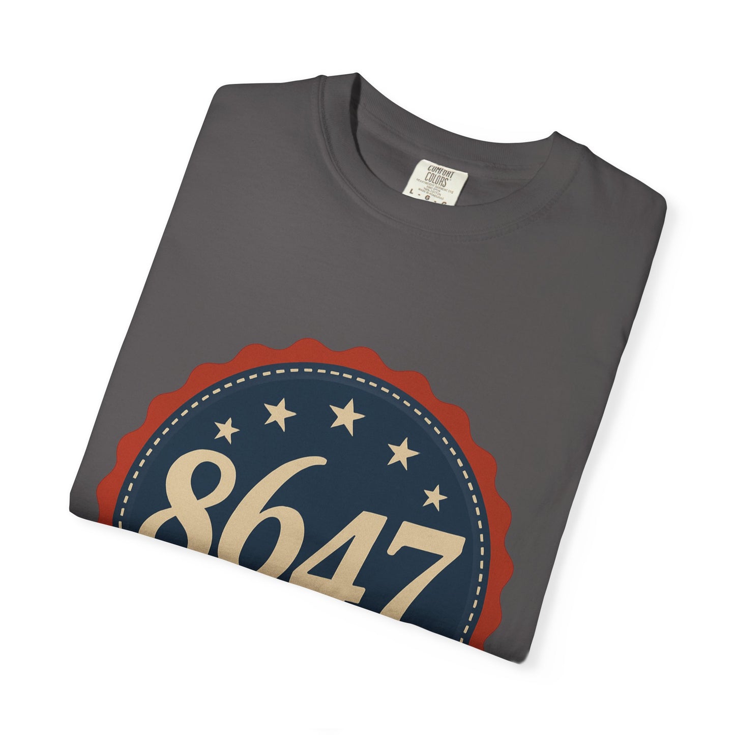8647 DJT He's Gotta Go Unisex Garment-Dyed Tee. Large front logo design