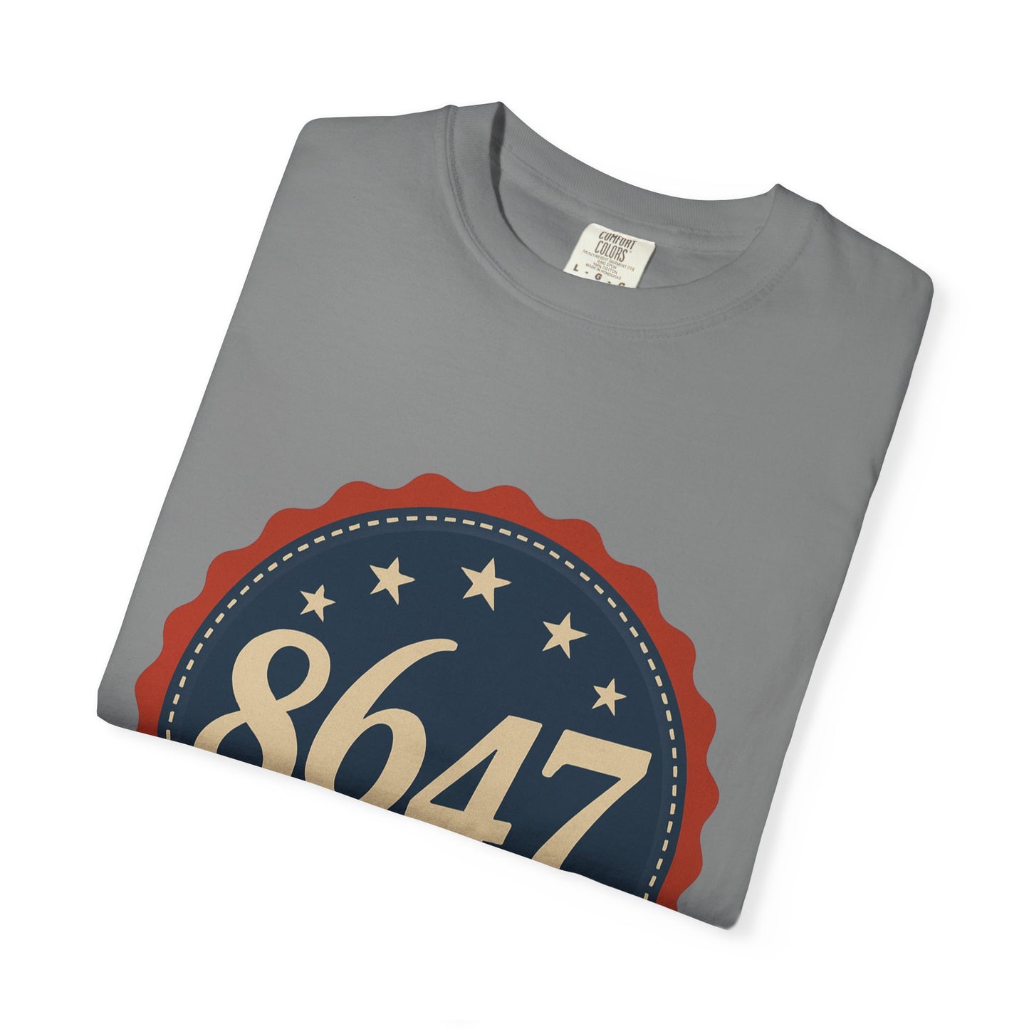 8647 DJT He's Gotta Go Unisex Garment-Dyed Tee. Large front logo design