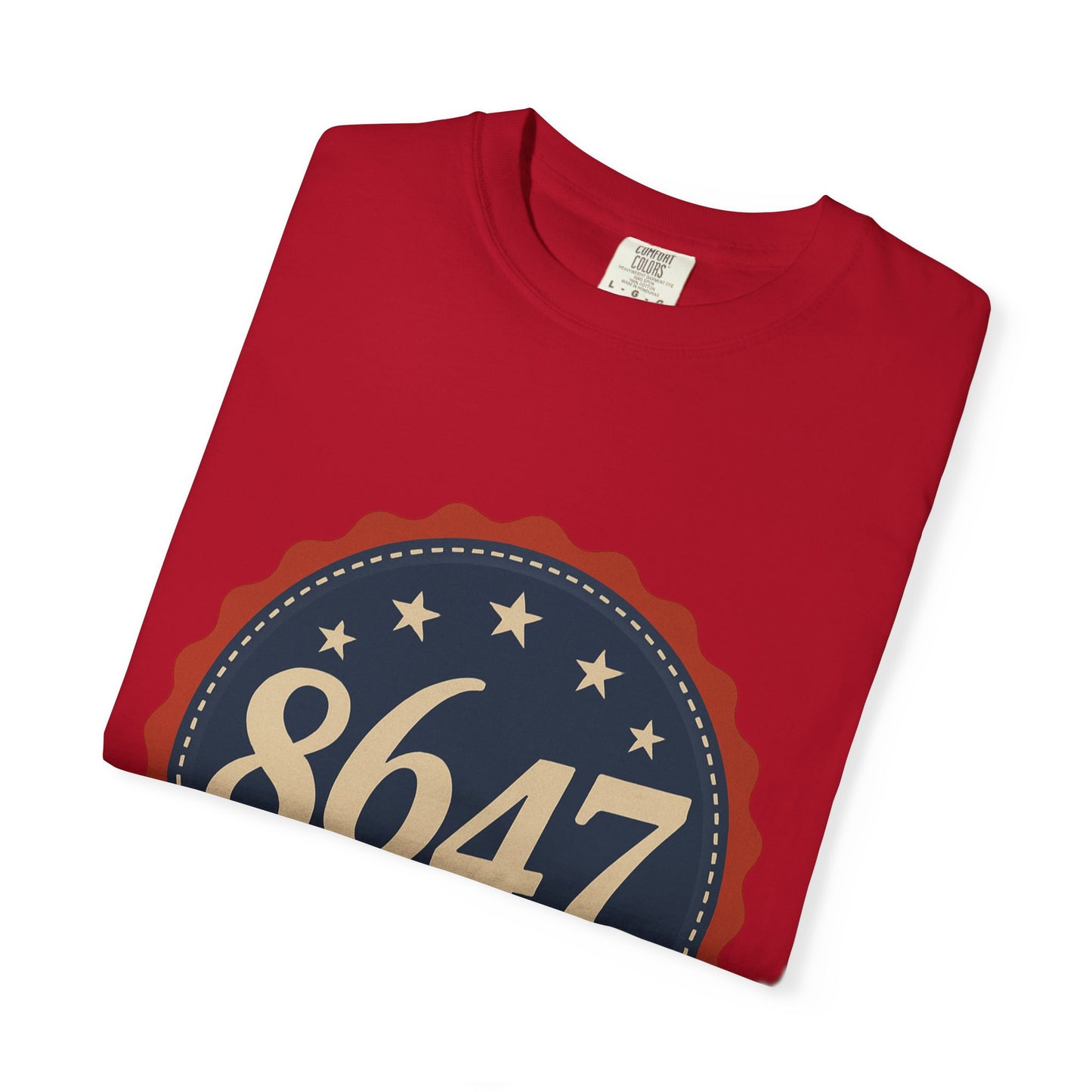 8647 DJT He's Gotta Go Unisex Garment-Dyed Tee. Large front logo design