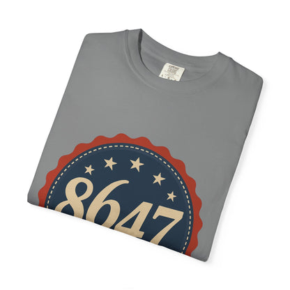 8647 DJT He's Gotta Go Unisex Garment-Dyed Tee. Large front logo design