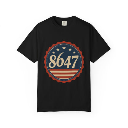 8647 DJT He's Gotta Go Unisex Garment-Dyed Tee. Large front logo design